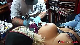 Shyla Stylez gets tattooed while playing with her globes
